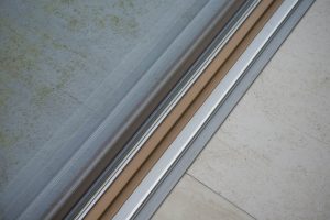 low threshold sliding doors made of timber and uPVC material